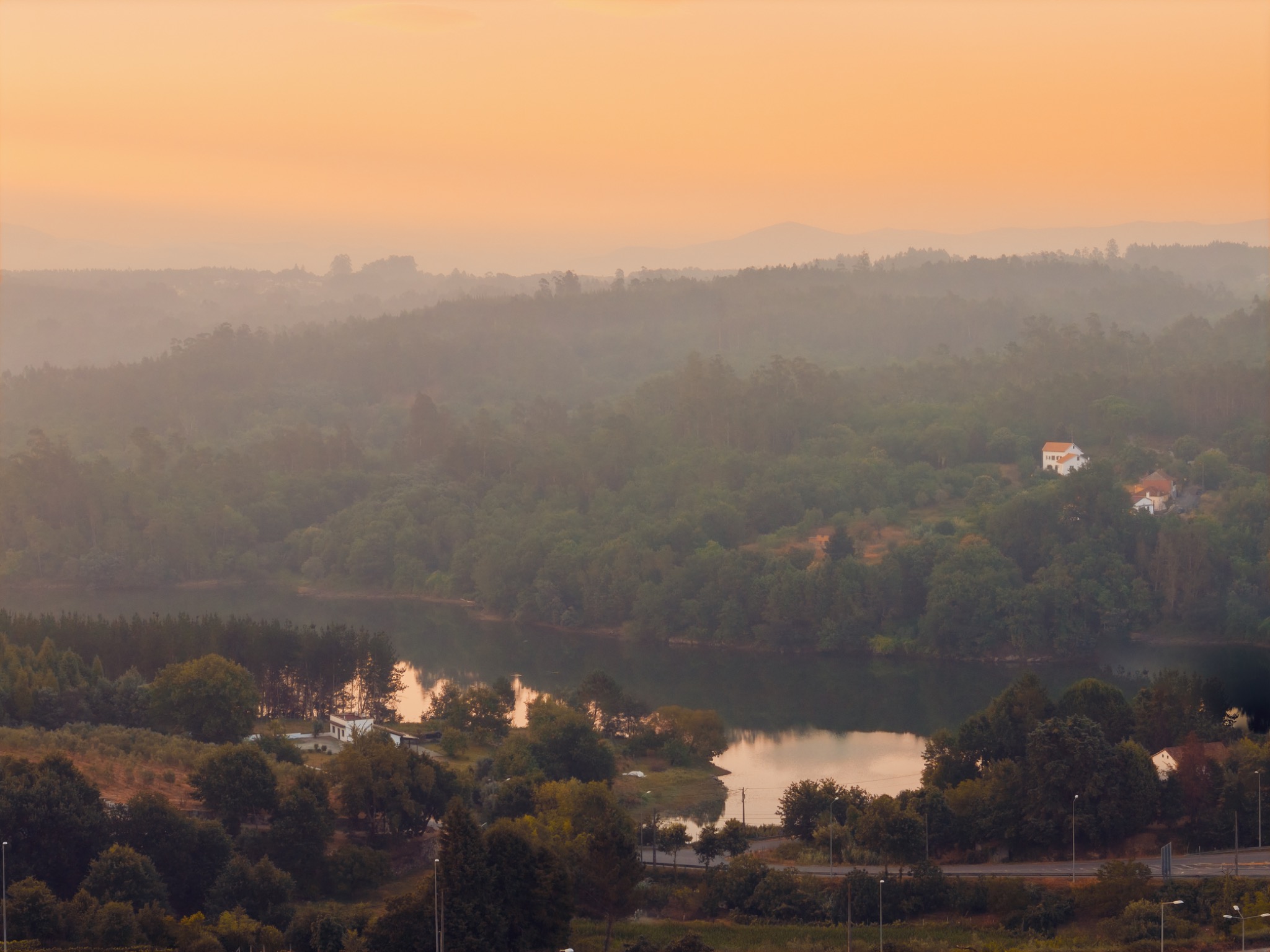 Sunset across the wooded hills and river near Santa Comba Dão