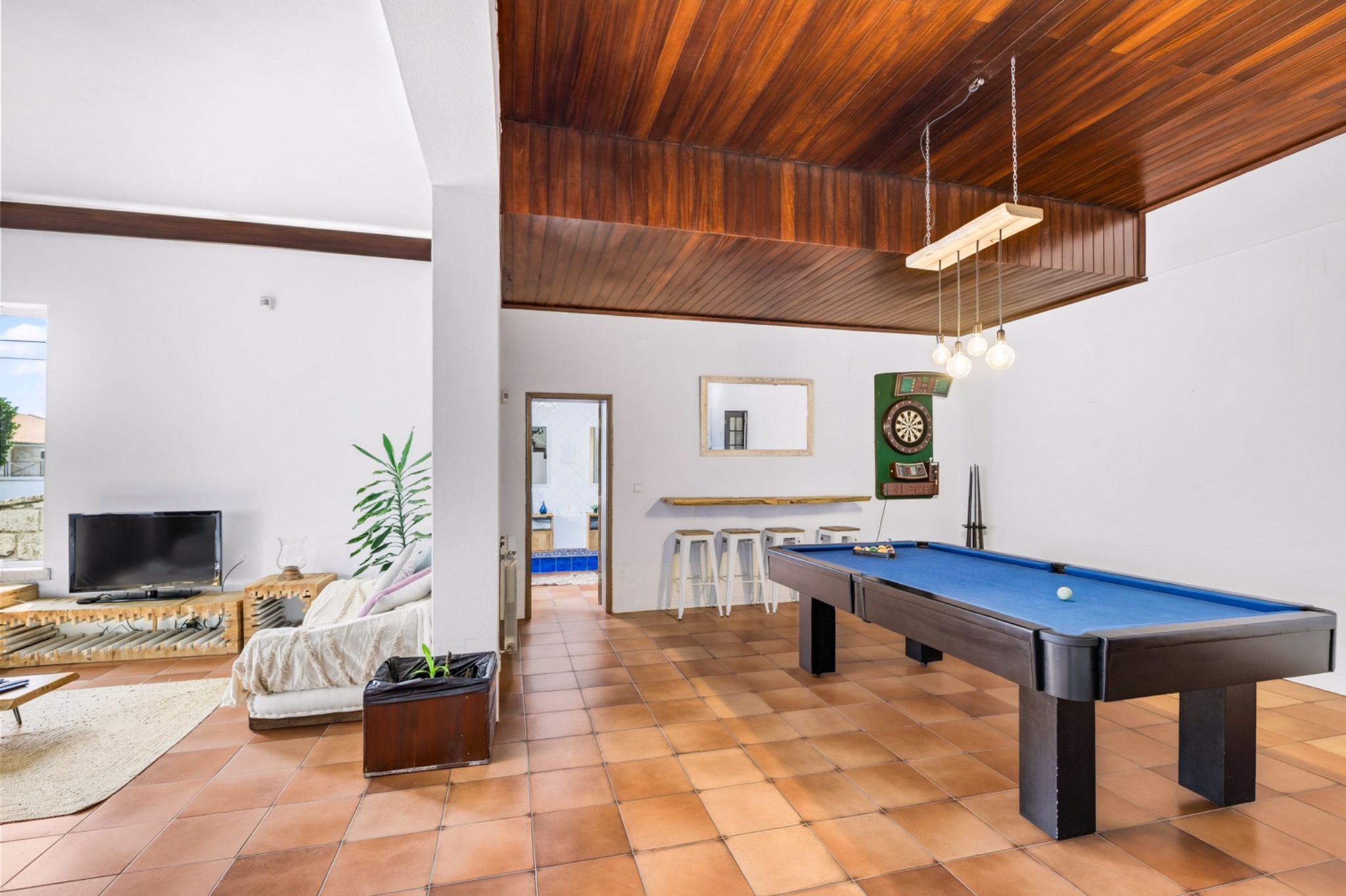 Shared games lounge with pool table and sofas